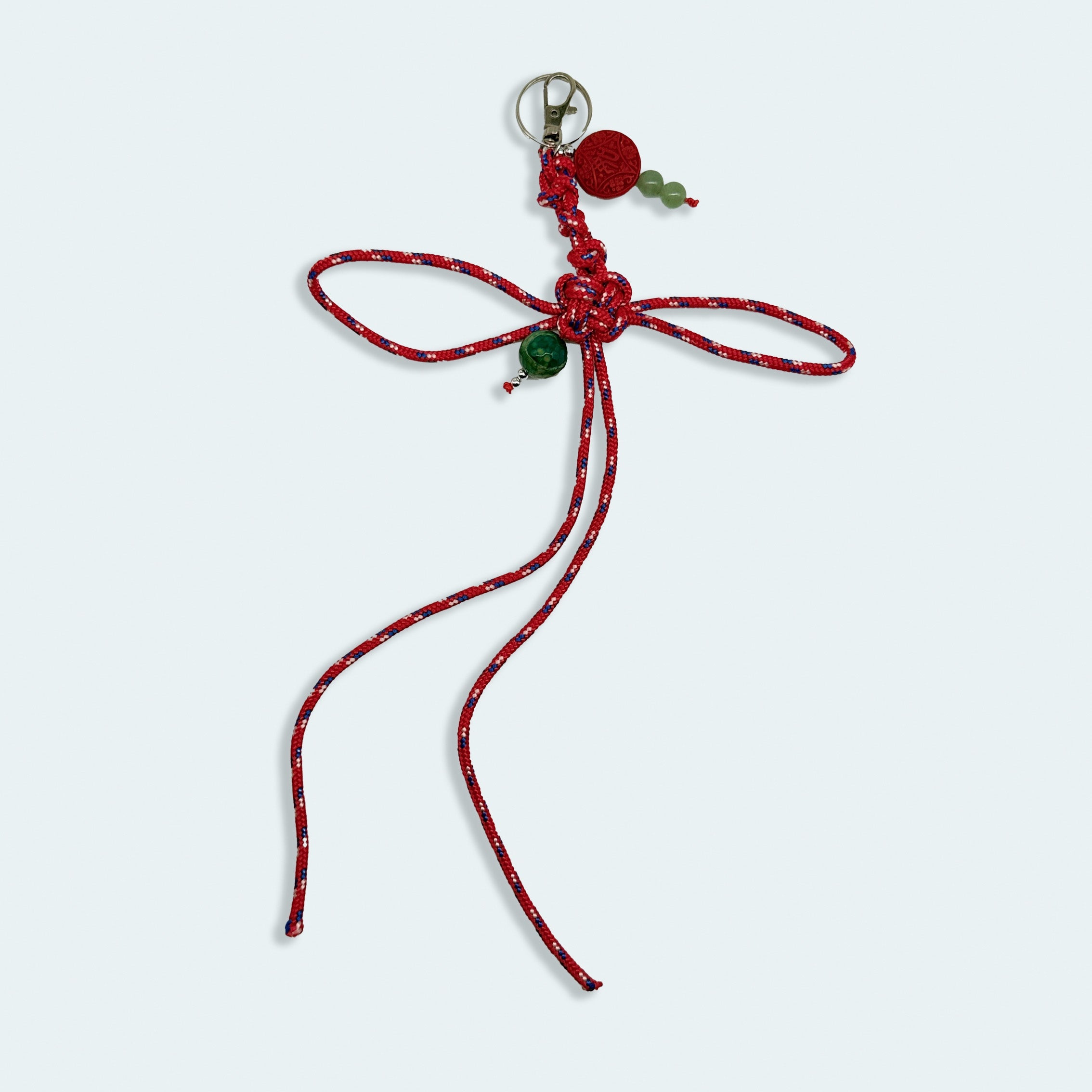 'a charmed charm' patterned red