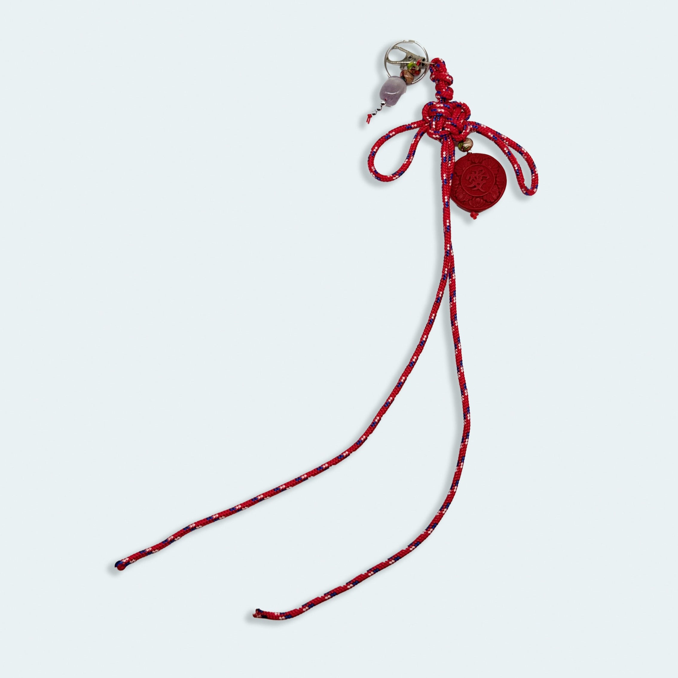 'a charmed charm' patterned red