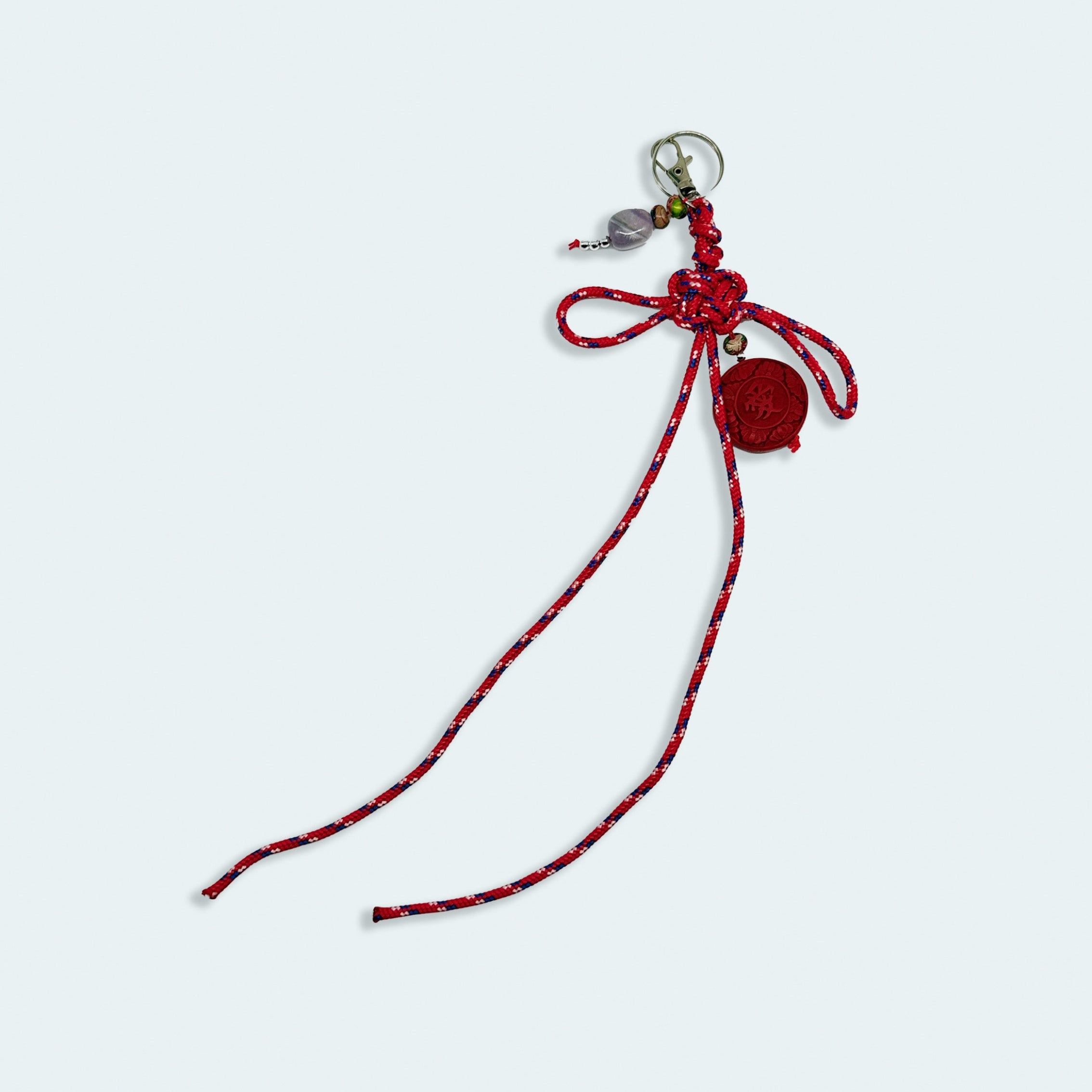 'a charmed charm' patterned red